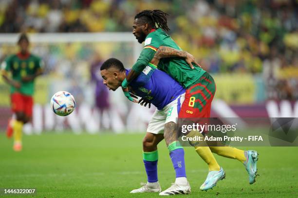 Andre-Frank Zambo Anguissa of Cameroon battles for possession with Gabriel Jesus of Brazil during the FIFA World Cup Qatar 2022 Group G match between...