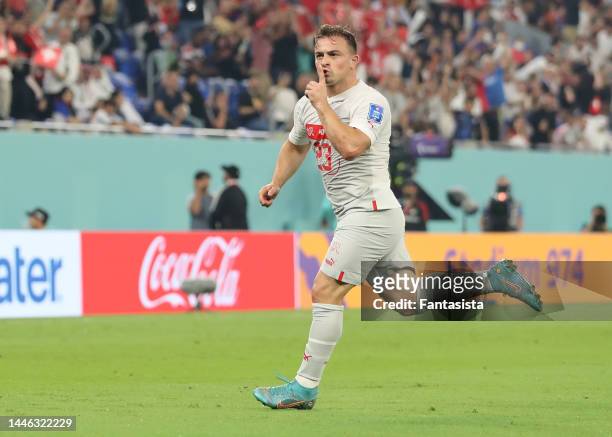 Xherdan Shaqiri of Switzerland celebrates after scoring to give the side a 1-0 lead during the FIFA World Cup Qatar 2022 Group G match between Serbia...