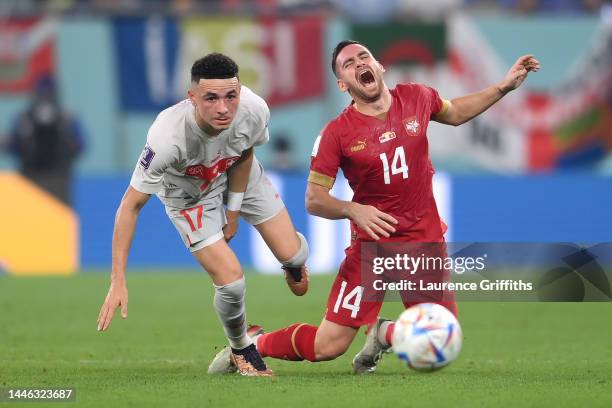 Ruben Vargas of Switzerland battles for possession with Andrija Zivkovic of Serbia during the FIFA World Cup Qatar 2022 Group G match between Serbia...