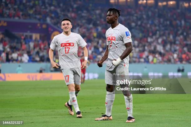 Breel Embolo of Switzerland celebrates after scoring the team's second goal with teammate Ruben Vargas during the FIFA World Cup Qatar 2022 Group G...