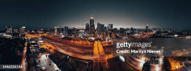atlanta busy streets and illuminated skyline at sunset - "marilyn nieves" stock pictures, royalty-free photos & images
