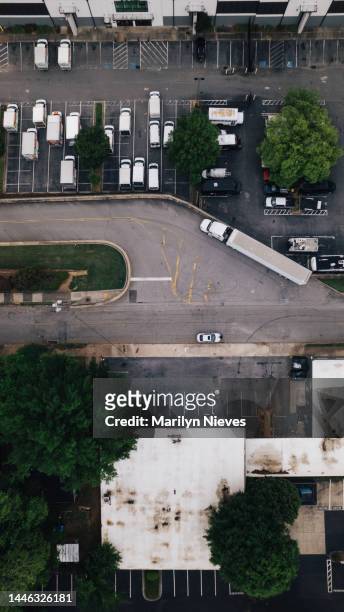 aerial of truck parking and warehouse - "marilyn nieves" stock pictures, royalty-free photos & images