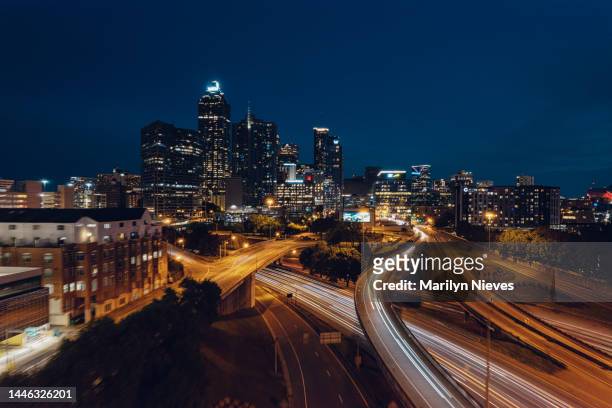 cars zooming through atlanta city streets - "marilyn nieves" stock pictures, royalty-free photos & images