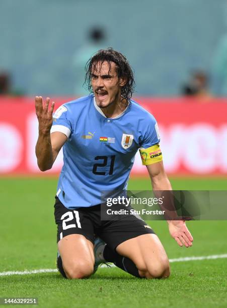 Edinson Cavani of Uruguay reacts after being felled in the penalty area during the FIFA World Cup Qatar 2022 Group H match between Ghana and Uruguay...