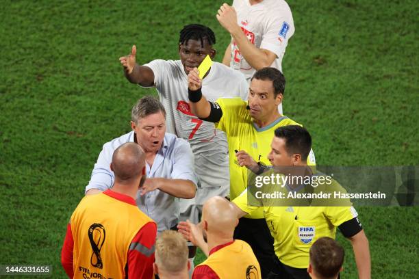 Predrag Rajkovic of Serbia is shown a yellow card by referee Fernando Andres Rapallini during the FIFA World Cup Qatar 2022 Group G match between...