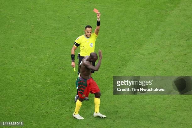 Referee Ismail Elfath shows a red card to Vincent Aboubakar of Cameroon after they scored their sides first goal during the FIFA World Cup Qatar 2022...