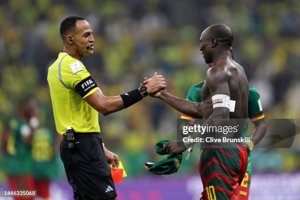 Referee Ismail Elfath shows a red card to Vincent Aboubakar of Cameroon after they scored their sides first goal during the FIFA World Cup Qatar 2022...