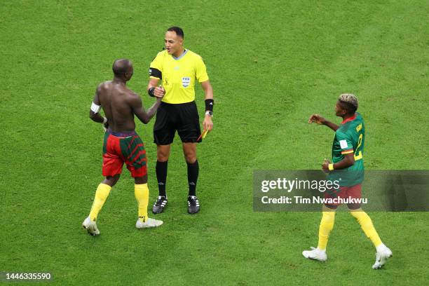 Referee Ismail Elfath shows a red card to Vincent Aboubakar of Cameroon after they scored their sides first goal during the FIFA World Cup Qatar 2022...