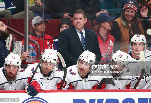 Head coach Peter Laviolette of the Washington Capitals looks on from the bench during their NHL game against the Vancouver Canucks at Rogers Arena...