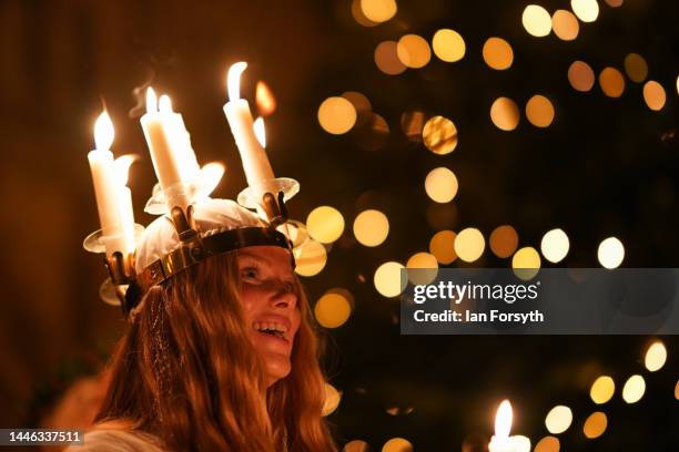 Clara Nordin originally from Gothenburg, plays the role of Lucia as she leads the procession during the Swedish Sankta Lucia festival of Light...