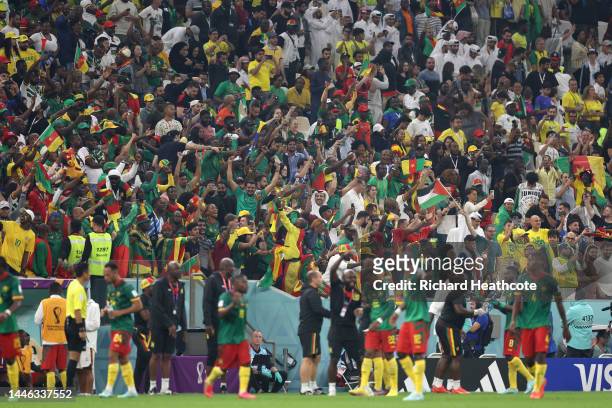 Cameroon fans celebrate after the team's victory during the FIFA World Cup Qatar 2022 Group G match between Cameroon and Brazil at Lusail Stadium on...