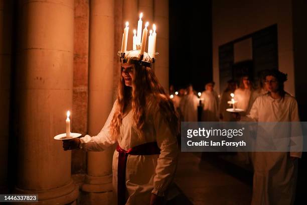 Clara Nordin originally from Gothenburg, plays the role of Lucia as she leads the procession during the Swedish Sankta Lucia festival of Light...