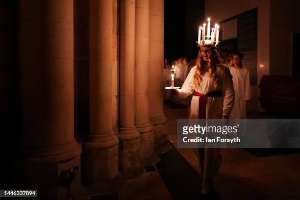 Clara Nordin originally from Gothenburg, plays the role of Lucia as she leads the procession during the Swedish Sankta Lucia festival of Light...