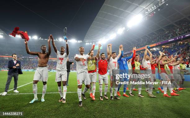 Switzerland players applaud fans after their 3-2 victory and qualification for the knockout stage prior to the FIFA World Cup Qatar 2022 Group G...