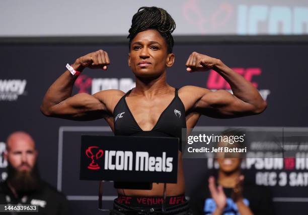 Angela Hill poses on the scale during the UFC Fight Night ceremonial weigh-in at Amway Center on December 02, 2022 in Orlando, Florida.