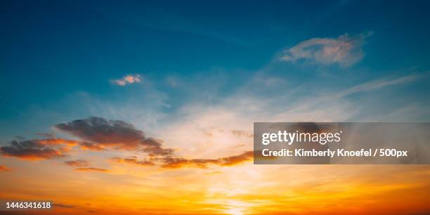 sunset sunrise sky background bright dramatic sky in yellow,orange and blue colors,united states,usa - cloud sky dusk stock pictures, royalty-free photos & images