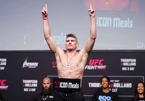 Stephen Thompson poses on the scale during the UFC Fight Night ceremonial weigh-in at Amway Center on December 02, 2022 in Orlando, Florida.