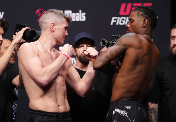 Opponents Stephen Thompson and Kevin Holland face off during the UFC Fight Night ceremonial weigh-in at Amway Center on December 02, 2022 in Orlando,...