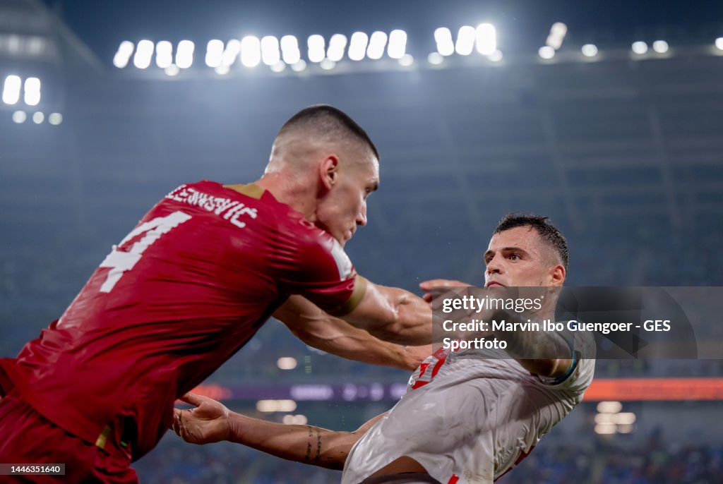 Granit Xhaka of Switzerland is attacked by Nikola Milenkovic of News  Photo - Getty Images