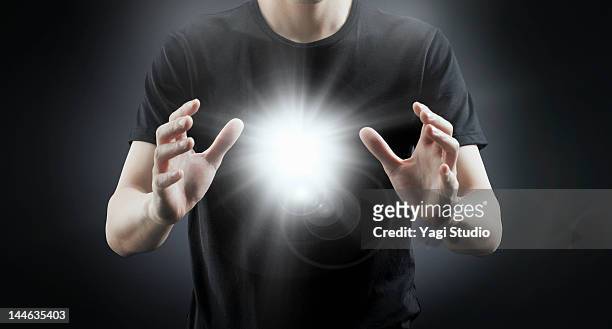 man with light. - position physique photos et images de collection