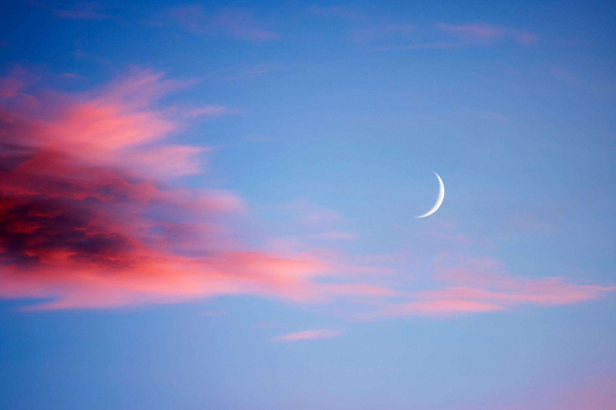 New moon and red sunset clouds New moon and red sunset clouds