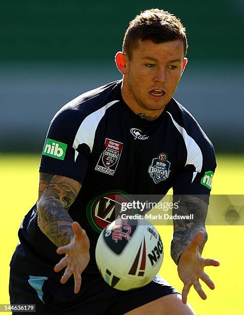 Todd Carney of the Blues looks to offload a pass during a New South Wales Blues State of Origin training session at AAMI Park on May 17, 2012 in...