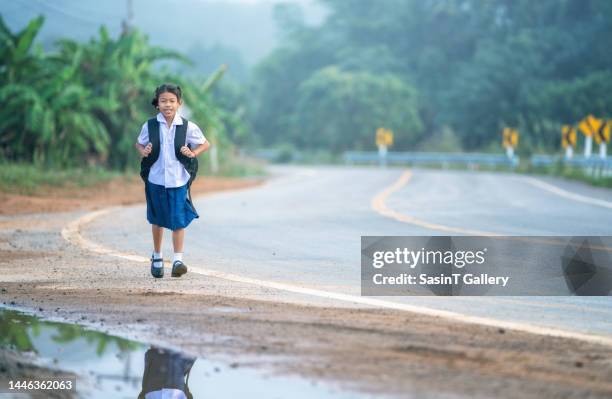 happy asian little girl goes to school - cute thai girl stock pictures, royalty-free photos & images