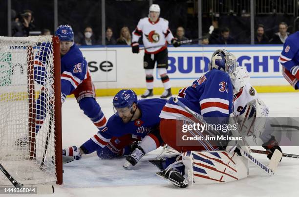 Barclay Goodrow of the New York Rangers stops the puck in the crease after a shot from Brady Tkachuk of the Ottawa Senators got past goalie Igor...