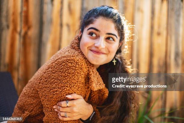 autumn patio portraits hispanic mexican american outdoors photo series - candid curly hair stock pictures, royalty-free photos & images