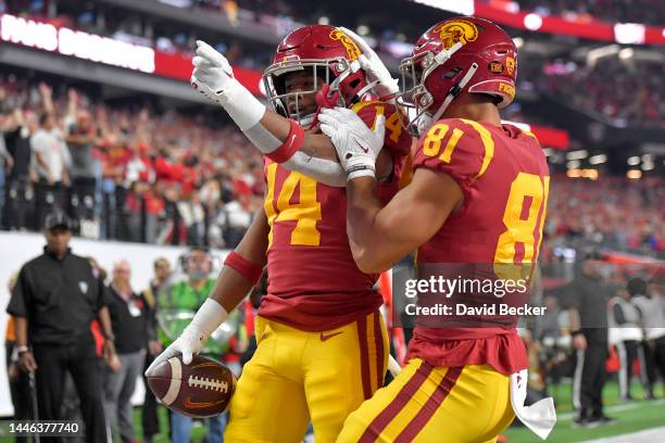 Raleek Brown of the USC Trojans celebrates with teammate Kyle Ford after scoring a touchdown against the Utah Utes during the first quarter in the...