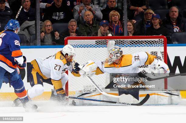 Ryan McDonagh of the Nashville Predators is hit and cut by the puck during the third period against the New York Islanders at the UBS Arena on...