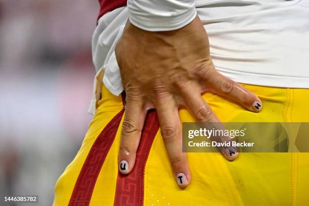 Detailed view of the fingernails of Caleb Williams of the USC Trojans that spell out Utah are seen on the sidelines during the third quarter in the...