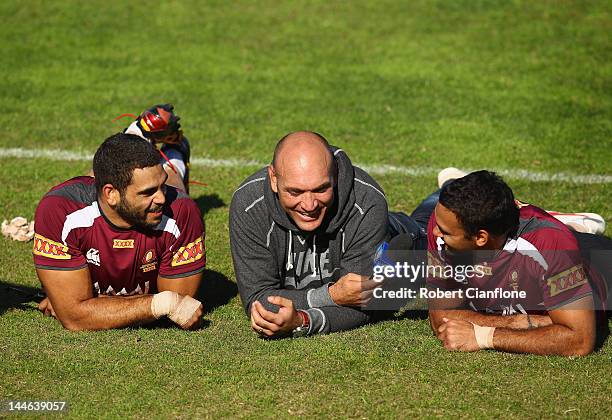 Greg Inglis and Justin Hodges of the Maroons are interviewed by Gordan Tallis during a Queensland Maroons State of Origin training session at Xavier...