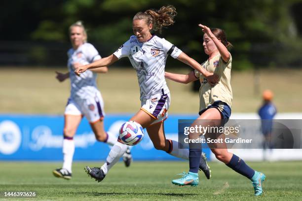 Elizabeth Anton of the Glory competes for the ball with Sarah Griffith of the Jets during the round 3 A-League Women's match between Newcastle Jets...