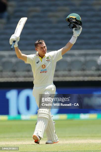 Marnus Labuschange of Australia raises his bat after scoring 100 runs during day four of the First Test match between Australia and the West Indies...