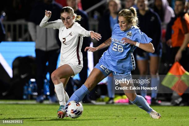 Maggie Pierce of North Carolina Tar Heels and Jenna Nighswonger of Florida State Seminoles battle for control of the ball in the first half during...
