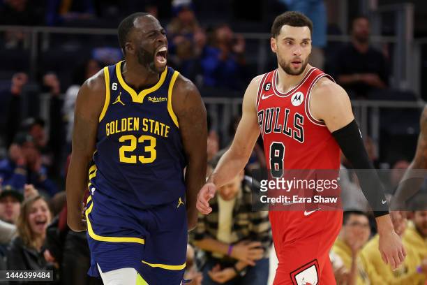 Draymond Green of the Golden State Warriors reacts in front of Zach LaVine of the Chicago Bulls after he made a basket in the fourth quarter at Chase...
