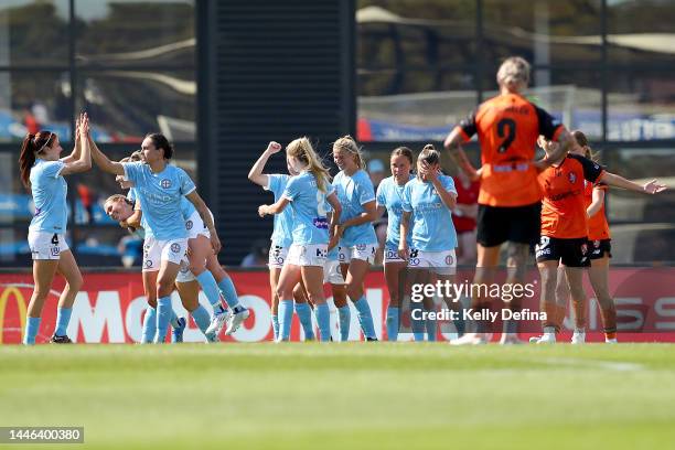 Emma Checker of Melbourne City and team mates celebrate during the round three A-League Women's match between Melbourne City and Brisbane Roar at...