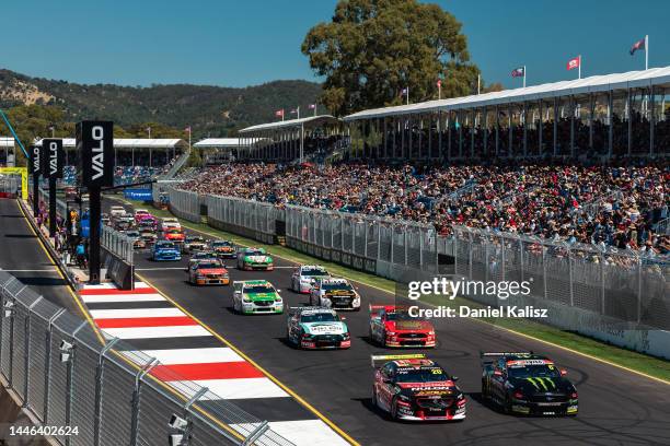 Scott Pye driver of the Seiko Racing Holden Commodore ZB and Cameron Waters driver of the Monster Energy Racing Ford Mustang lead at the start of...