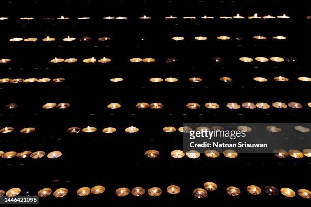 burning candle on black table. memory day - holocaust in color stock pictures, royalty-free photos & images