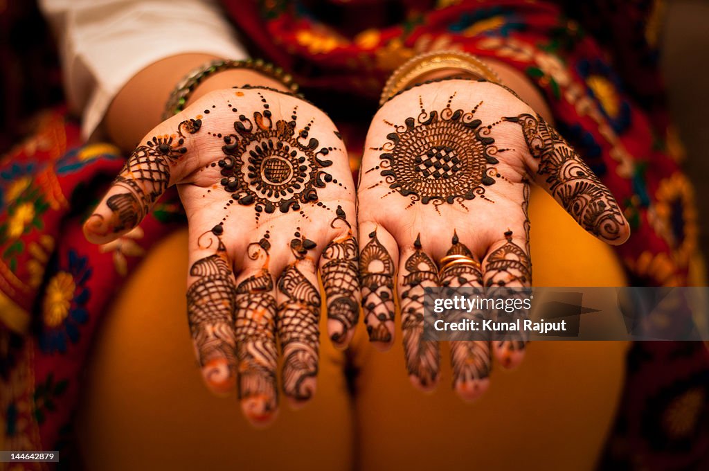 Close up of mehndi on hands
