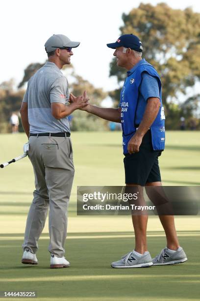 Adam Scott shakes hands with his caddie Steve Williams on the 18th green Day 3 of the 2022 ISPS HANDA Australian Open at Victoria Golf Club December...