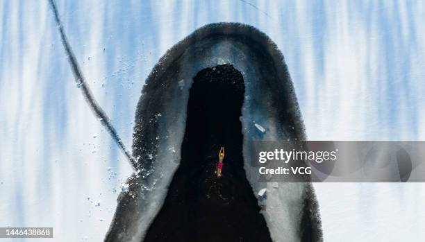 Aerial view of a winter swimmer swimming in a pool carved out of a frozen lake at Beiling Park on December 3, 2022 in Shenyang, Liaoning Province of...