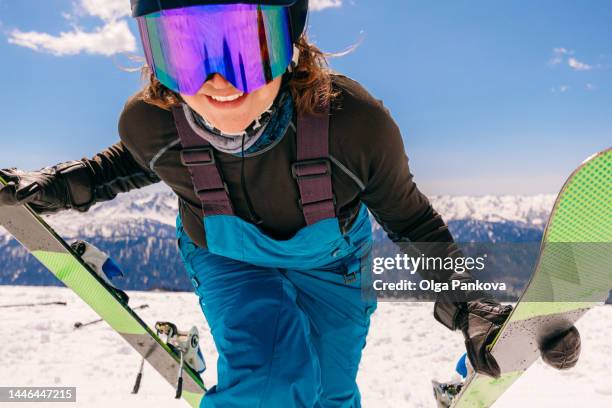 happy female skier in the mountains on a sunny day - happy skier stockfoto's en -beelden
