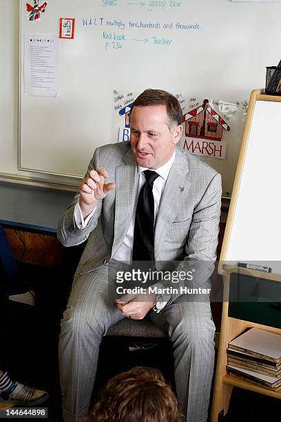 New Zealand Prime Minister John Key talks to children during a visit to Cashmere Primary School on May 17, 2012 in Christchurch, New Zealand. Prime...