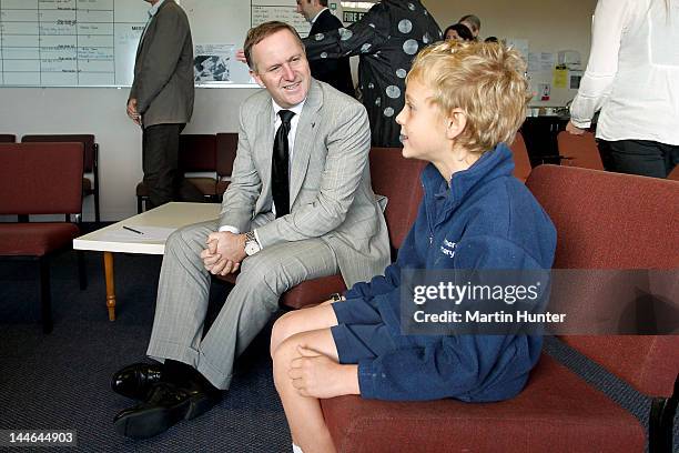 New Zealand Prime Minister John Key talks to Sam Willems during a visit to Cashmere Primary School on May 17, 2012 in Christchurch, New Zealand....