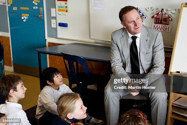 New Zealand Prime Minister John Key talks to children during a visit to Cashmere Primary School on May 17, 2012 in Christchurch, New Zealand. Prime...