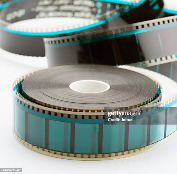 close-up shot of a 35mm blank film reel. on white background - 35 mm film stock-fotos und bilder