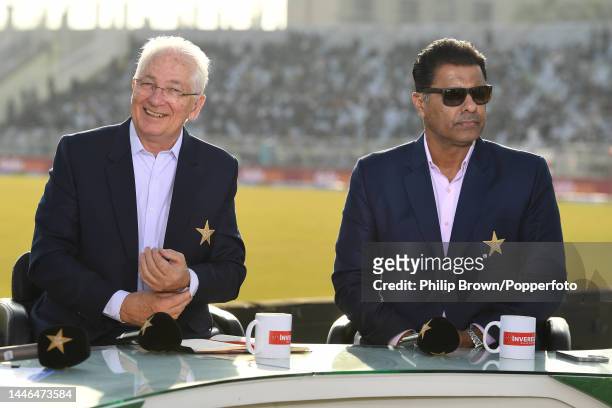 David Gower and Waqar Younis working for Pakistan television during the third day of the first Test between Pakistan and England at Rawalpindi...