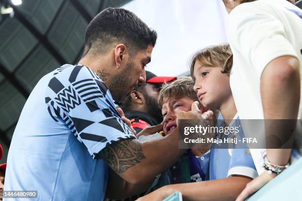 Luis Suarez of Uruguay reacts with family members and fans in the stands after his team's elimination during the FIFA World Cup Qatar 2022 Group H...